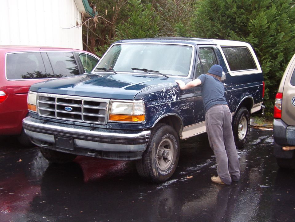 On a nice, cold, rainy day, he got to spend his first quality time with the truck.  This is just the first pass - it's gonna need several more cleanings before the paint can be touched up.