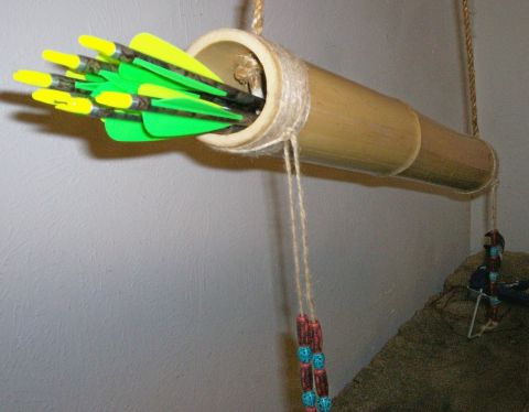 1993 Ford Bronco - A bamboo quiver filled with arrows is hanging, with twine and beads attached.
