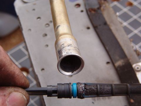 1993 Ford Bronco - This orifice tube is blue (with black residue on most of it), indicating it's for R-12. Note the fine metal shavings on the filter screen,…
