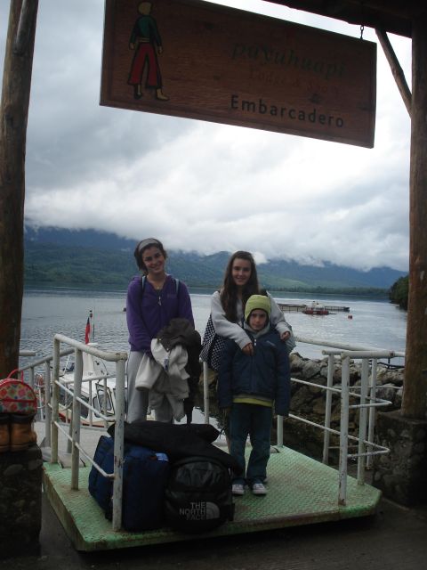 1986 Ford Bronco - Family waits for the ferry at Puyuhuapi Embarcadero with luggage.
