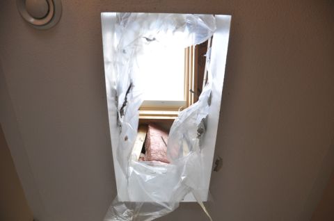 1996 Ford Bronco - Skylight tunnel showing damage and exposed insulation.