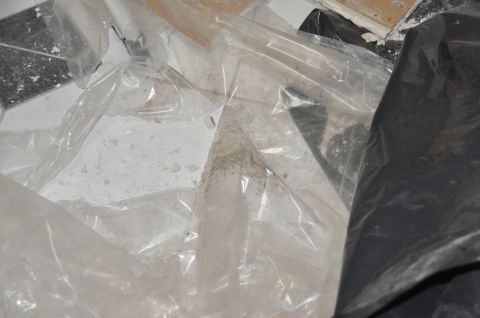 1996 Ford Bronco - A scene of debris covered by plastic sheeting, with visible floor tiles.
