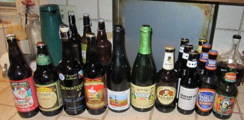 1990 Ford Bronco - A variety of beer bottles are displayed on a kitchen counter.