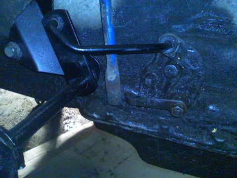 1979 Ford F-250 - Undercarriage components are visible, with a blue tool inserted into a linkage.