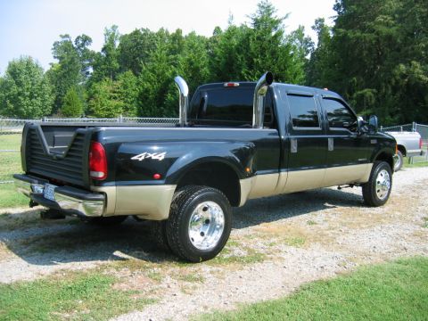 1992 Ford Mustang - This Ford F-350 Super Duty pickup truck features dual rear wheels and prominent exhaust stacks.