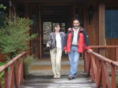 1986 Ford Bronco - A couple stands on a wooden walkway leading to a lodge entrance during a vacation.