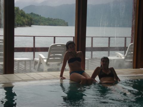 1986 Ford Bronco - Women in a pool with a lake and mountain view.