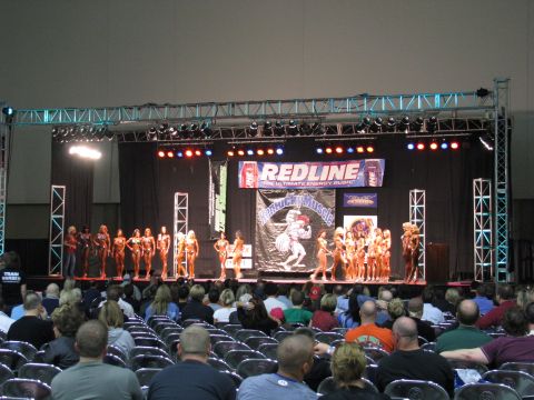2003 Mercury Marauder - A bodybuilding competition takes place on a stage with an audience watching.
