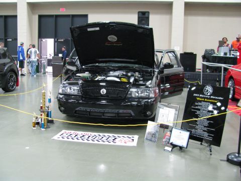 2003 Mercury Marauder - A black 2003 Mercury Marauder is displayed with its hood open at a car show.