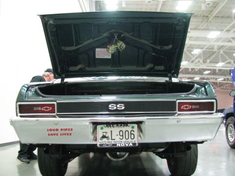 2003 Mercury Marauder - Rear view of a green Chevrolet Nova SS, an open trunk, "SS" badging, and a license plate that reads "L-906 NOVA".