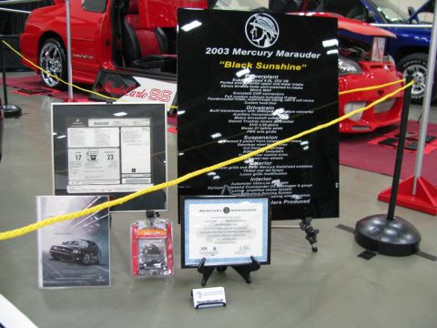2003 Mercury Marauder - Display for a 2003 Mercury Marauder at a car show, specifications and a window sticker.