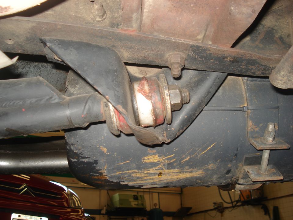 Underbody suspension part with red and white bushings