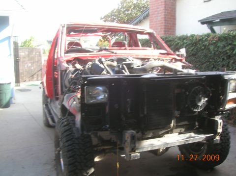 1985 Ford Bronco - This 1985 Ford Bronco is in a state of rebuild, with its front end disassembled and engine exposed.