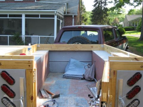 1996 Ford Bronco - View into the rear of a 1996 Ford Bronco from the bed of a trailer.