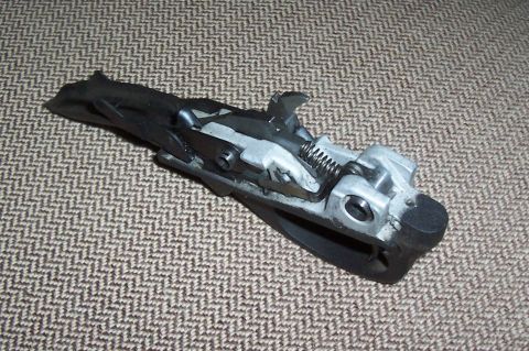 1994 Ford F-150 - A mechanical component, possibly from a vehicle, is shown against a patterned background.