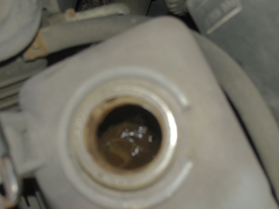 Coolant reservoir with murky fluid inside