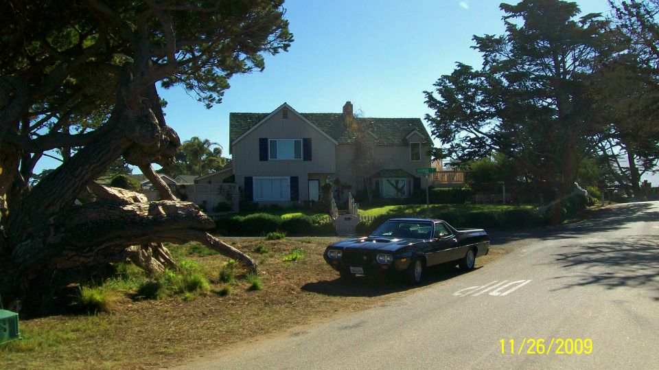 1972 Ford Ranchero parked on a residential street next to a house