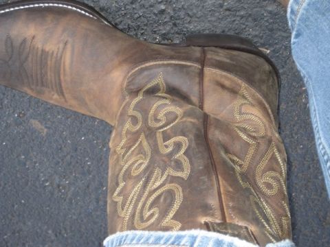 2004 Ford F-150 - Close-up of a brown leather cowboy boot with decorative stitching.