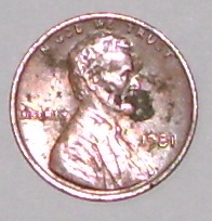 1998 Ford Crown Victoria - A single 1981 US penny is shown, with visible text and Lincoln's profile.