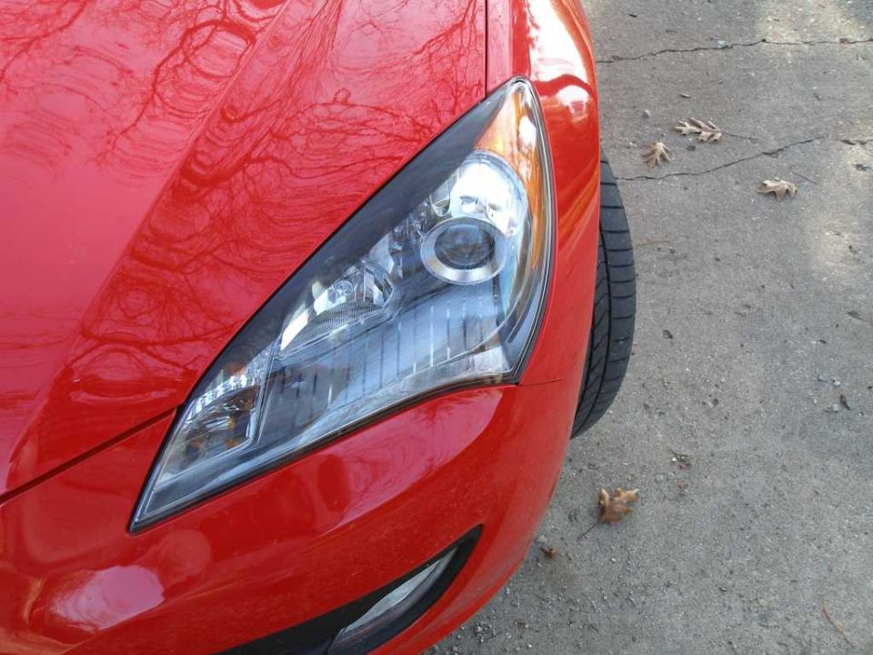 2010 Hyundai Genesis front passenger side headlight and fender, red paint