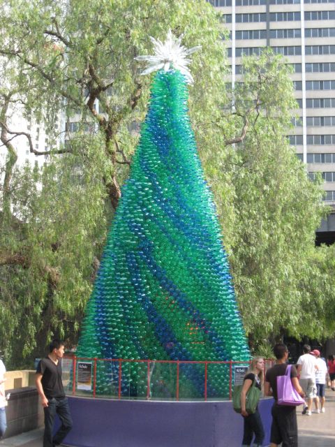 2008 Ford F-250 - An art installation of a Christmas tree made from recycled plastic bottles stands in an urban setting.