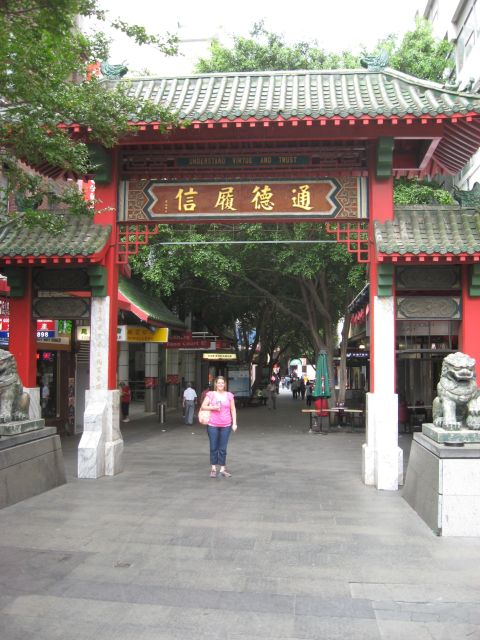 2008 Ford F-250 - A woman stands in front of a decorative Chinatown gate traditional architecture and signage.