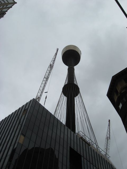 2008 Ford F-250 - A view looking up at a tower under construction, with cranes and buildings surrounding it.