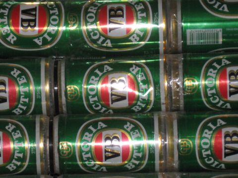 2008 Ford F-250 - A close-up view of multiple cans of Victoria Bitter beer stacked together.