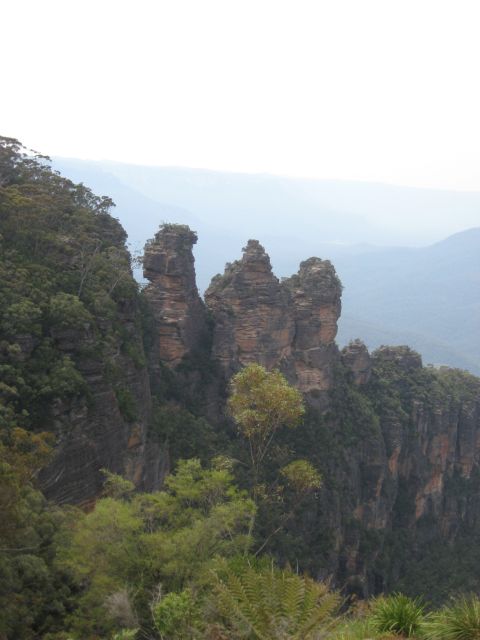2008 Ford F-250 - The Three Sisters rock formation in the Blue Mountains, Australia, under a hazy sky.