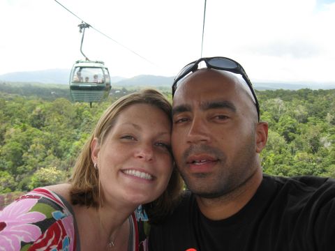 2008 Ford F-250 - A couple enjoys a scenic ride in a cable car, with lush green forest visible in the background.