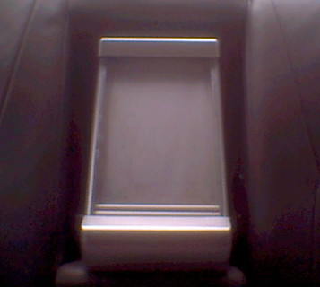 1997 Ford Taurus - Center console armrest storage compartment is open.