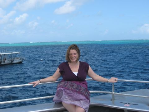 2008 Ford F-250 - A woman poses for a photo on the deck of a boat with another vessel visible in the distance.