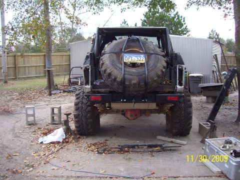 1978 Ford Bronco - Rear view of a 1978 Ford Bronco, showing its external spare tire carrier and license plate.