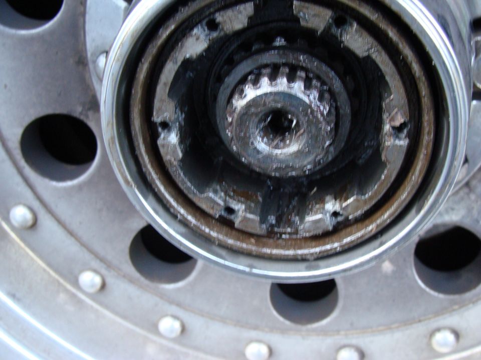 Close-up of a dirty manual locking hub with splines visible
