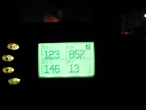 2004 Ford F-150 - A digital gauge displays various vehicle metrics including temperature, RPM, and MPG.