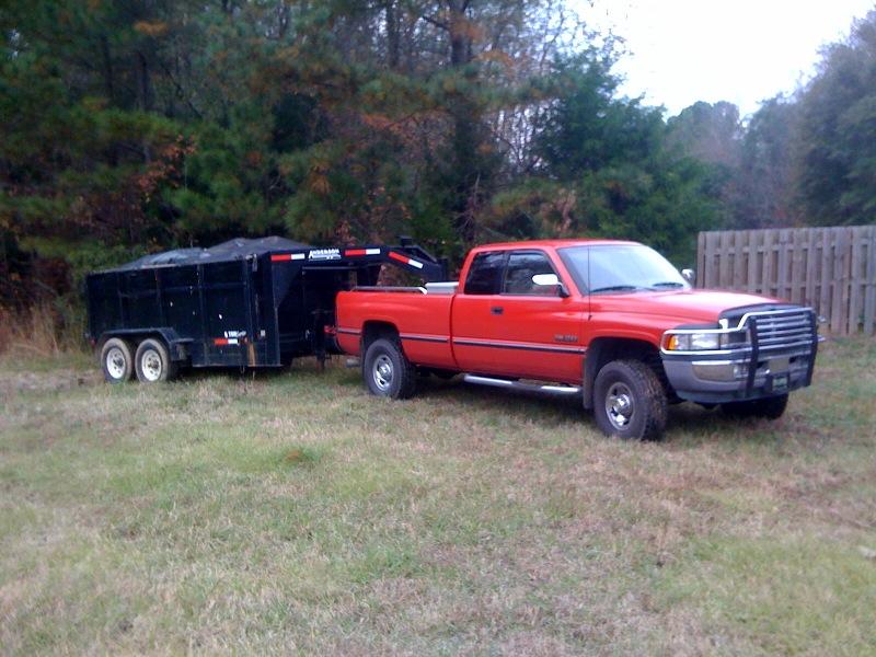 Red pickup truck with a black trailer, 3/4 front view, 1994 model year