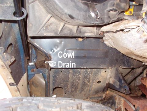 1993 Ford Bronco - Looking rearward, the cowl drain can be inspected. This & the one on the driver's side often hold rotting leaves which can rust the body &…