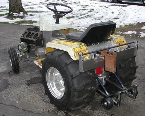 1972 Ford Ranchero - This heavily modified tractor features a V8 engine and oversized rear wheels, deviating significantly from a standard 1972 Ford Ranchero.