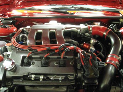 1994 Ford Probe - Close-up of a car's engine bay, showing various components and wiring.