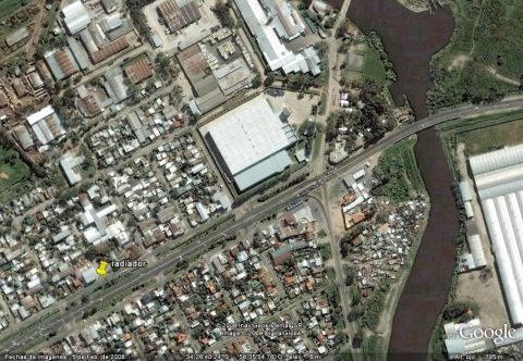 1986 Ford Bronco - An aerial perspective captures a town bisected by a river, with industrial and residential zones visible.