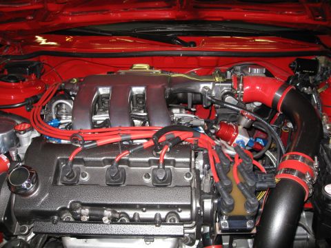 1994 Ford Probe - Close-up view of a car's engine bay, showing various components and wiring.