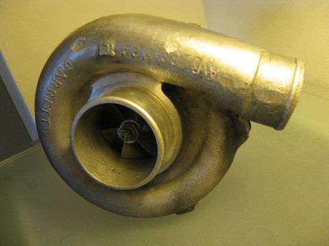 1994 Ford Probe - A close-up view of a Garrett turbocharger, showing its internal components and external markings.