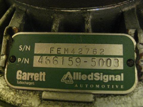 1994 Ford Probe - Close-up of a Garrett turbocharger identification plate showing serial and part numbers.