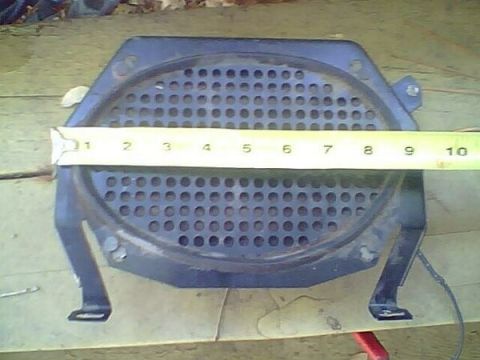 1972 Ford Ranchero - A speaker grille is measured with a tape measure, indicating its size.