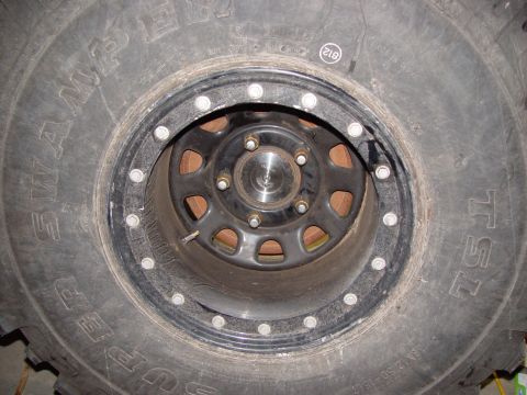 1993 Ford Bronco - Off-road tire and wheel assembly with visible brake rotor.