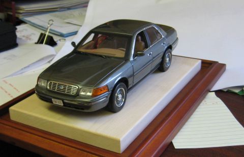 1999 Ford Crown Victoria - This 1999 Ford Crown Victoria is presented as a 1/18th scale model on a wooden display base.