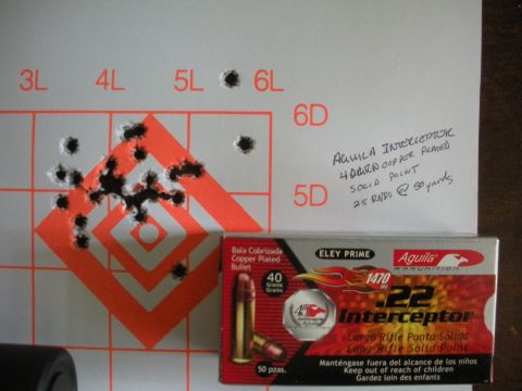 1996 Ford Bronco - A target shows a cluster of bullet holes, alongside a box of Aguila .22 Interceptor ammunition and handwritten notes about the shooting ses…