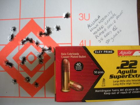 1996 Ford Bronco - Ammunition test results show a grouping of shots on a target, alongside a box of .22 caliber cartridges.