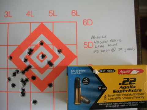 1996 Ford Bronco - A target displays bullet impacts from 25 rounds fired at 50 yards, alongside a box of Aguila .22 SuperExtra ammunition.