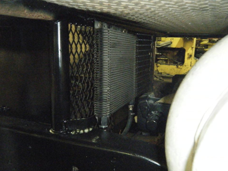 transmission cooler mounted under vehicle chassis